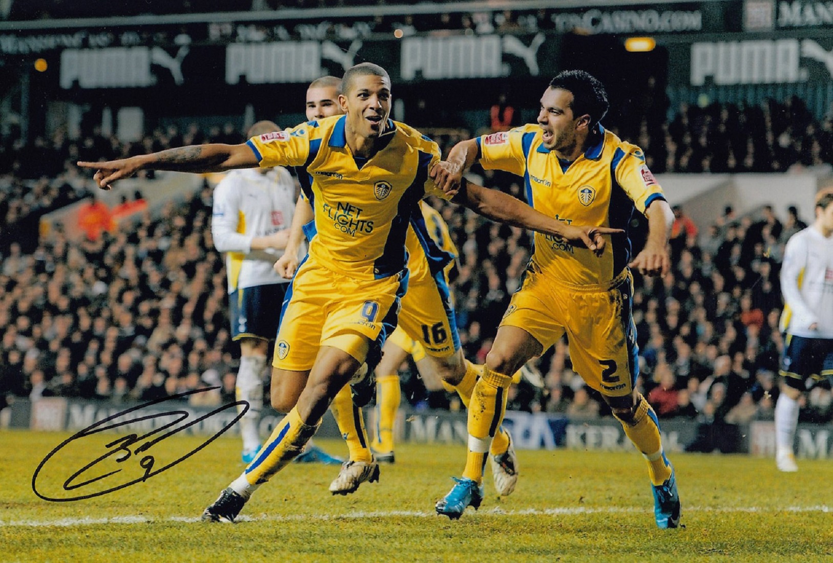 Football Autographed JERMAINE BECKFORD 12 x 8 Photo : Col, depicting Leeds United's JERMAINE