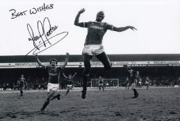 Football Autographed TERRY CONNOR 12 x 8 Photo : B/W, depicting a wonderful image showing Brighton &