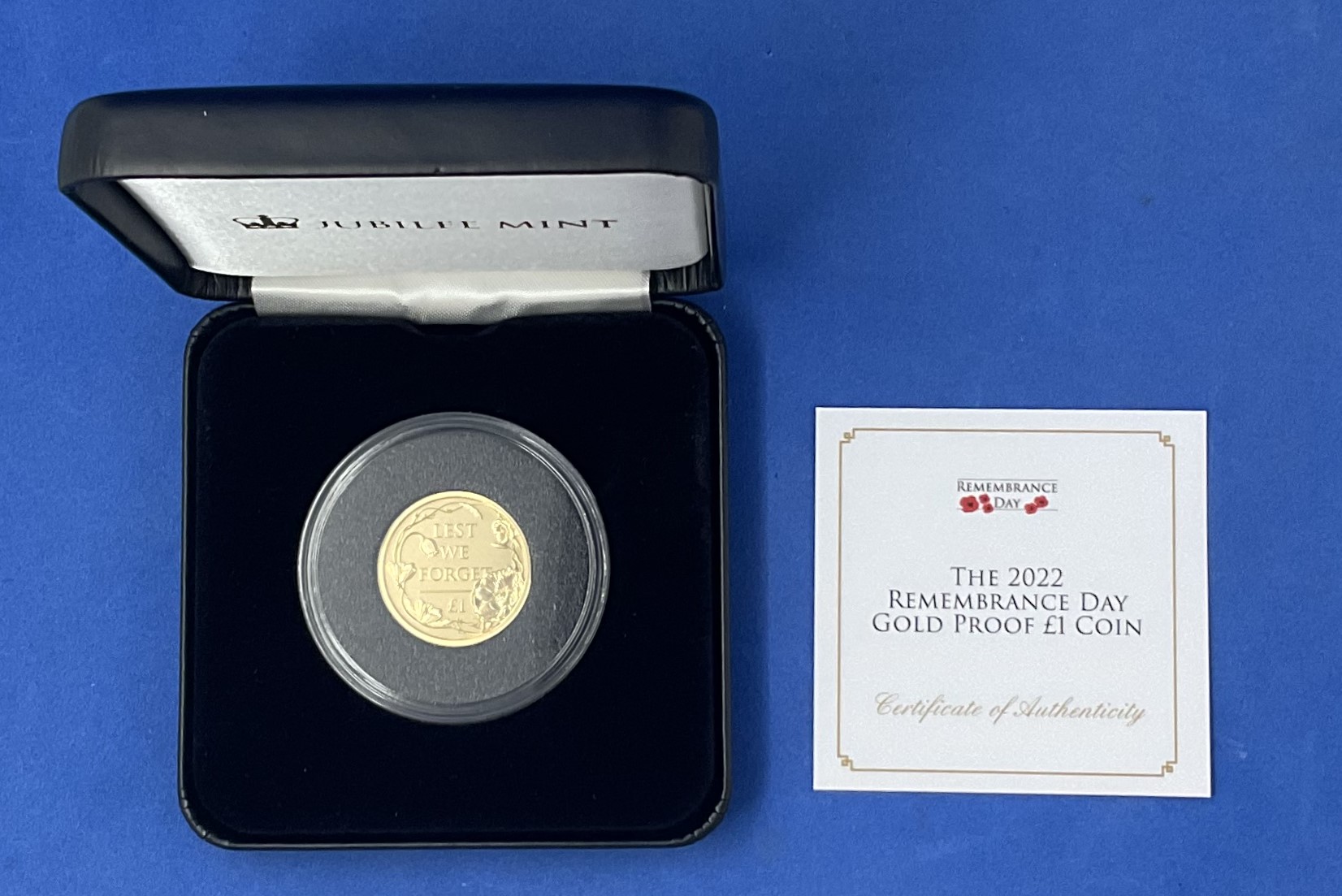 The 2022 Remembrance Day Gold Proof One pound Coin, Jubilee Mint. In Black display case. Good - Image 2 of 2