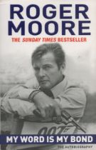 Roger Moore signed My World Is My Bond The Autobiography paperback book. Good Condition. All