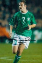 Football Jason McAteer signed 12x8 inch colour photo pictured in action for the Republic of Ireland.