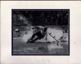 Tom Finney signed black and white splashdown photo. Mounted to approx. size 14x12inch. All