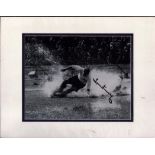 Tom Finney signed black and white splashdown photo. Mounted to approx. size 14x12inch. All