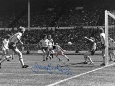 Football Autographed TREVOR BROOKING 16 x 12 Photo : Colz, depicting an iconic image showing West