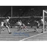 Football Autographed TREVOR BROOKING 16 x 12 Photo : Colz, depicting an iconic image showing West