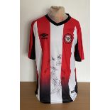 Brentford Football club multi signed football shirt signed by current squad members and others.