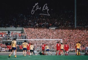 Football Autographed EDDIE KELLY 12 x 8 Photo : Col, depicting the scene as EDDIE KELLY's weak