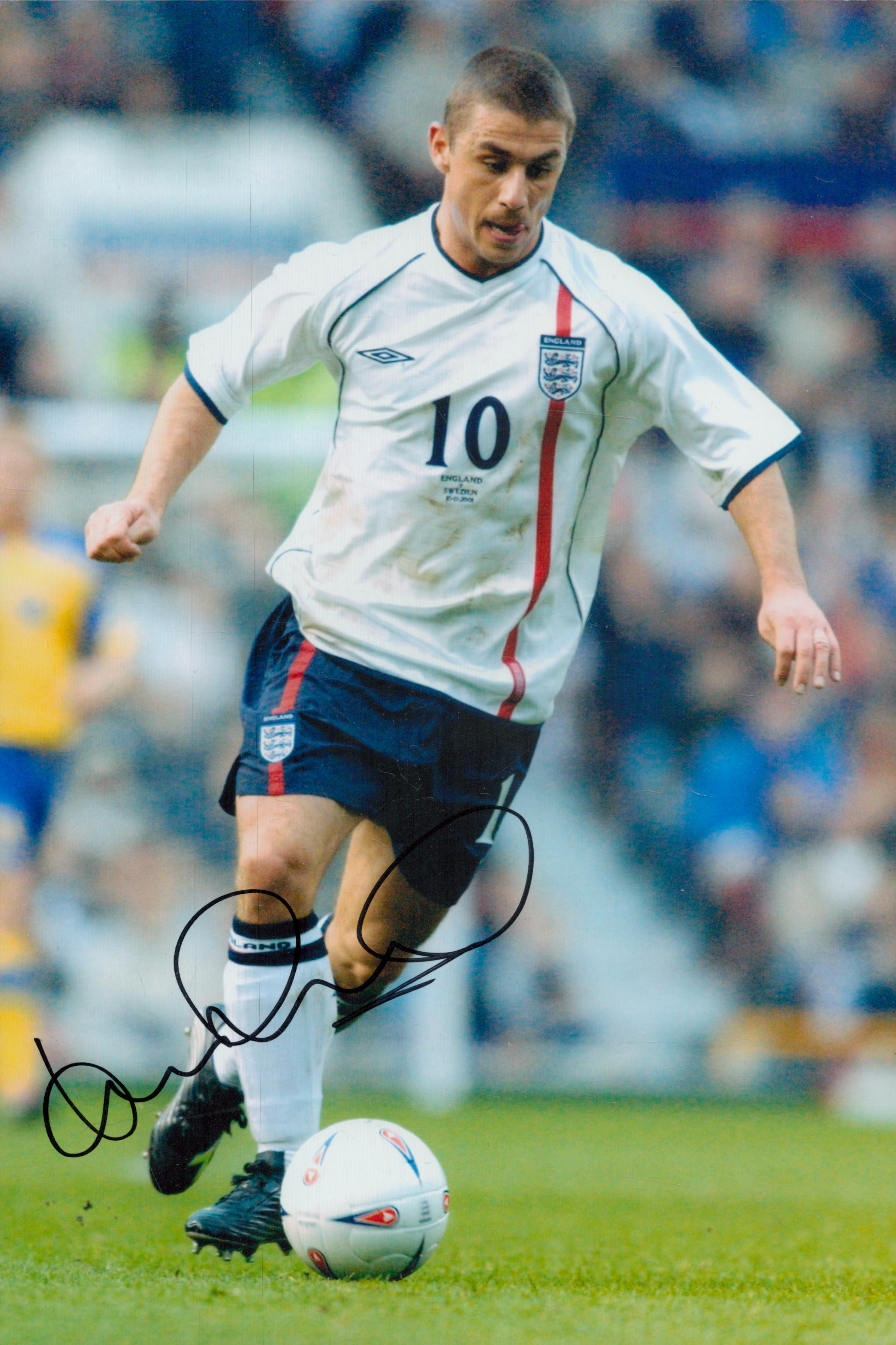 Football Kevin Phillips signed 12x8 inch colour photo pictured in action for England. All autographs