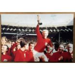 Geoff Hurst signed colour photo 18x12 Inch pictured celebrating The 1966 World Cup. All autographs