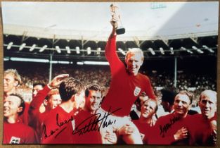 Multi signed Martin Peters, Geoff Hurst, George Cohen colour photo 18x12 Inch. The 1966 World Cup