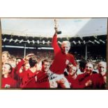 Multi signed Martin Peters, Geoff Hurst, George Cohen colour photo 18x12 Inch. The 1966 World Cup