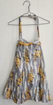 Jayne Mansfield personally owned bathing suit. One piece suit with a yellow, blue and white floral