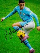 Phil Foden signed 8x6inch colour action photo of the Manchester City mid-fielder. Good Condition.