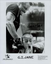 Demi Moore signed 10x8inch black and white movie still from G.I. Jane. Also comes with press pack