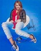 Miley Cyrus signed 10x8 inch colour photo. Good Condition. All autographs come with a Certificate of
