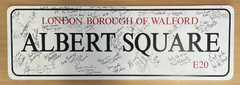 Eastenders multi signed Albert Square street sign. Signatures such as Laila Morse, Adam Woodyatt,