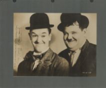 Laurel and Hardy signed 12x8 overall mounted sepia photo inscribed with our sincere good wishes