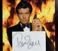 Pierce Brosnan signed 4x3 inch white card and James Bond 10x8 inch colour photo. Good Condition. All