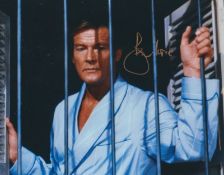 Roger Moore signed 10x8 inch James Bond colour photo. Good Condition. All autographs come with a