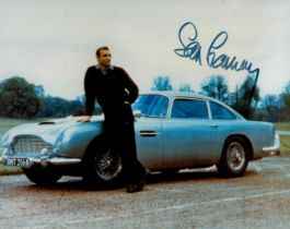 Sean Connery signed 10x8 inch colour pictured standing alongside Aston Martin. Good Condition. All