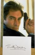 Timothy Dalton signed 6x4 inch white card and 10x8 inch James Bond colour photo. Good Condition. All