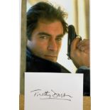 Timothy Dalton signed 6x4 inch white card and 10x8 inch James Bond colour photo. Good Condition. All