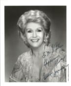 Debbie Reynolds signed 10x8 inch black and white photo. Dedicated. Good Condition Est