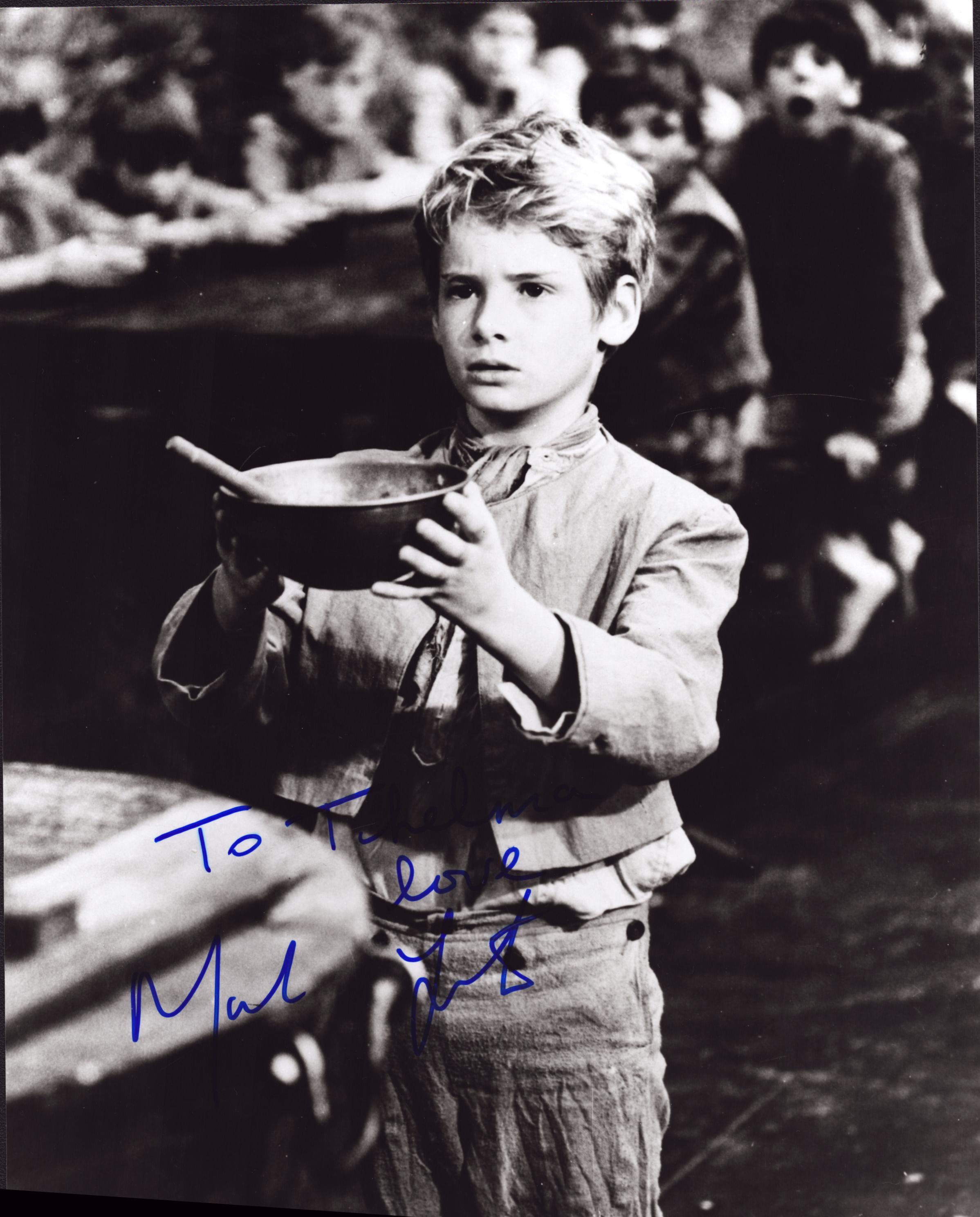 Mark Lester signed 10x8 inch black and white 'Oliver!' photo. DEDICATED. Good Condition Est.