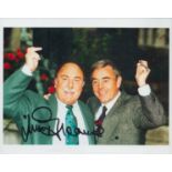 Jimmy Greaves signed 12x8 inch black and white photo pictured with his TV partner Ian St John.