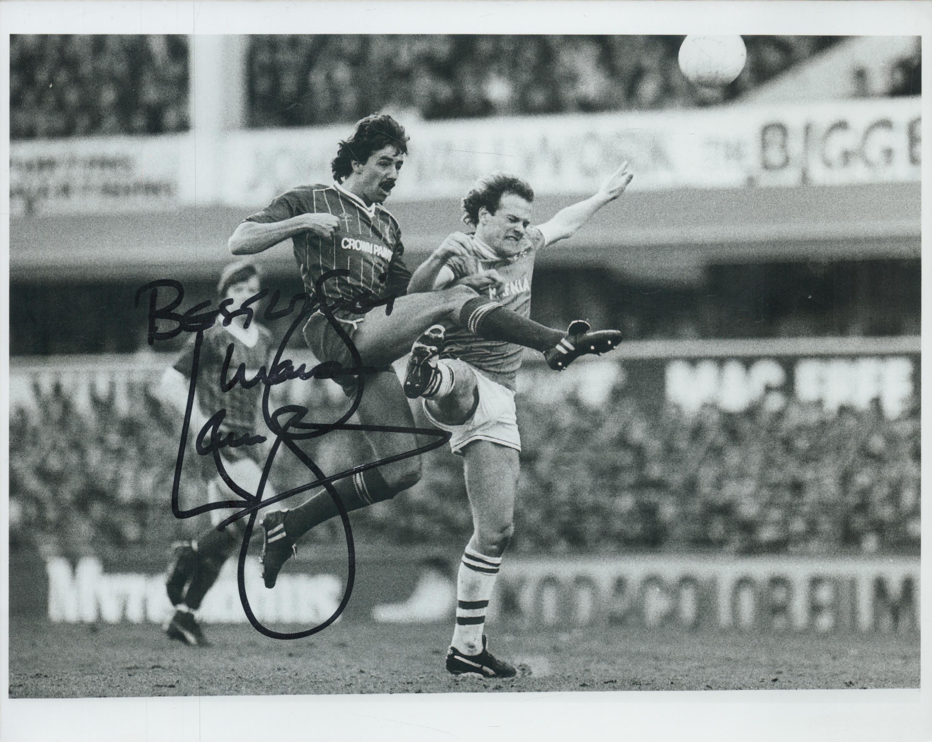 Mark Lawrenson signed 10x8 inch black and white photo pictured in action for Liverpool.