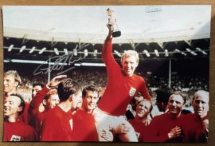 Geoff Hurst signed colour photo 18x12 Inch pictured celebrating The 1966 World Cup.