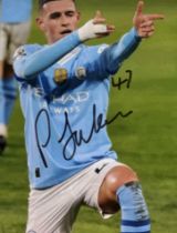 Phil Foden signed 8x6inch colour photo. Man City midfielder. Good Condition. All autographs come