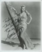 Esther Williams signed 10x8 inch black and white photo dedicated. Good Condition. All autographs