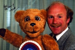 Roger De Courcey and Nookie Bear signed 12x8 inch colour photo. Good Condition. All autographs