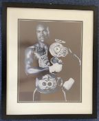 Evander Holyfield signed 20x16 mounted and framed black and white photo. Good Condition. All