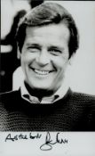 Sir Roger Moore, KBE signed Black and White Photo 5.5x3.5 Inch. Was an English actor. He was the