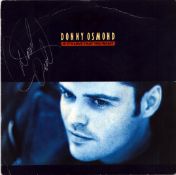 Donny Osmond signed vinyl sleeve including 7 inch single 45 rpm vinyl. Good Condition. All