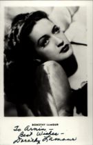 Dorothy Lamour (1914-1996), American actress. A signed and dedicated 5.5x3.5 inch photo postcard.
