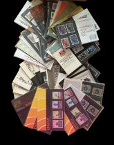 British Post Office mint stamp collection. 40+ individual sets still in original packs. Includes