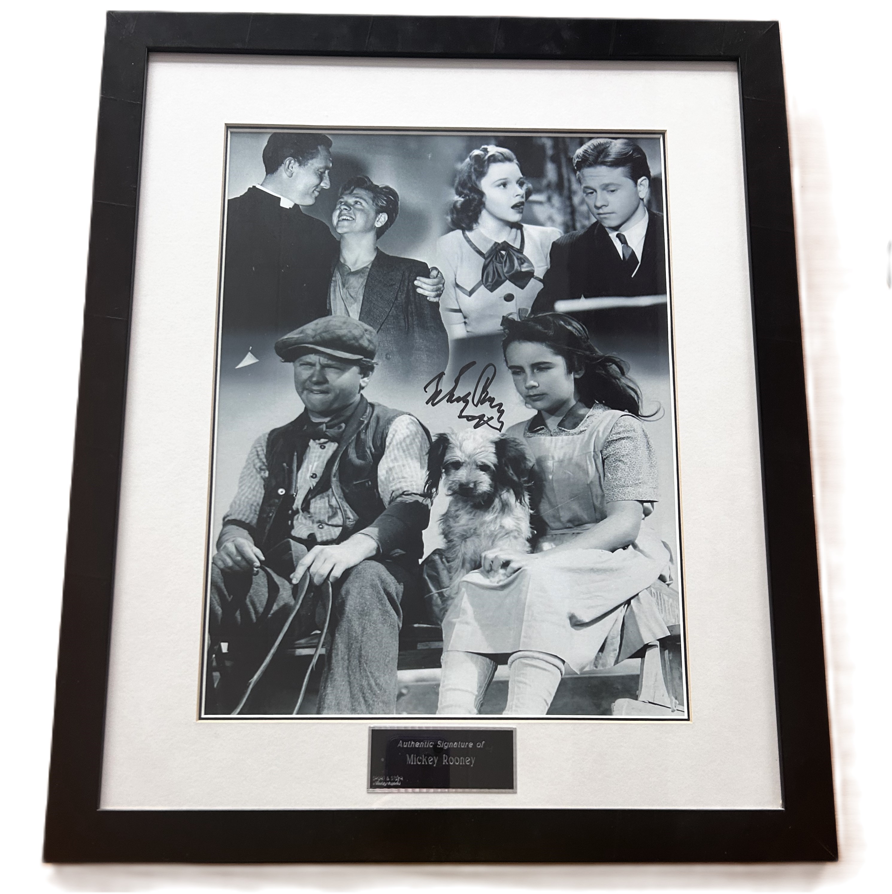 Mickey Rooney signed mounted and framed The Wizard of Oz black and white photo. Measures 22"x18"