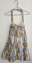 Jayne Mansfield personally owned bathing suit. One piece suit with a yellow, blue and white floral
