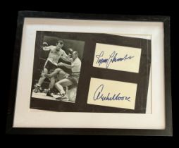 Ingemar Johansson and Archie Moore signed white cards. Framed and mounted with black and white