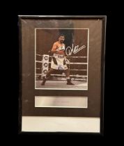 Amir Khian signed colour photo. Mounted and framed to approx size 12x8inch.