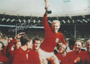 Geoff Hurst signed 18 inch by 12 inch colour photo, pictured celebrating after 1966 World Cup Final.