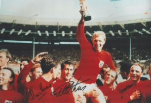 Geoff Hurst, Martin Peters and George Cohen signed 18 inch by 12 inch colour photo, pictured