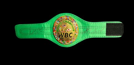 Gerry Cooney and Larry Holmes signed WBC mini replica belt. Good Condition. All autographs come with