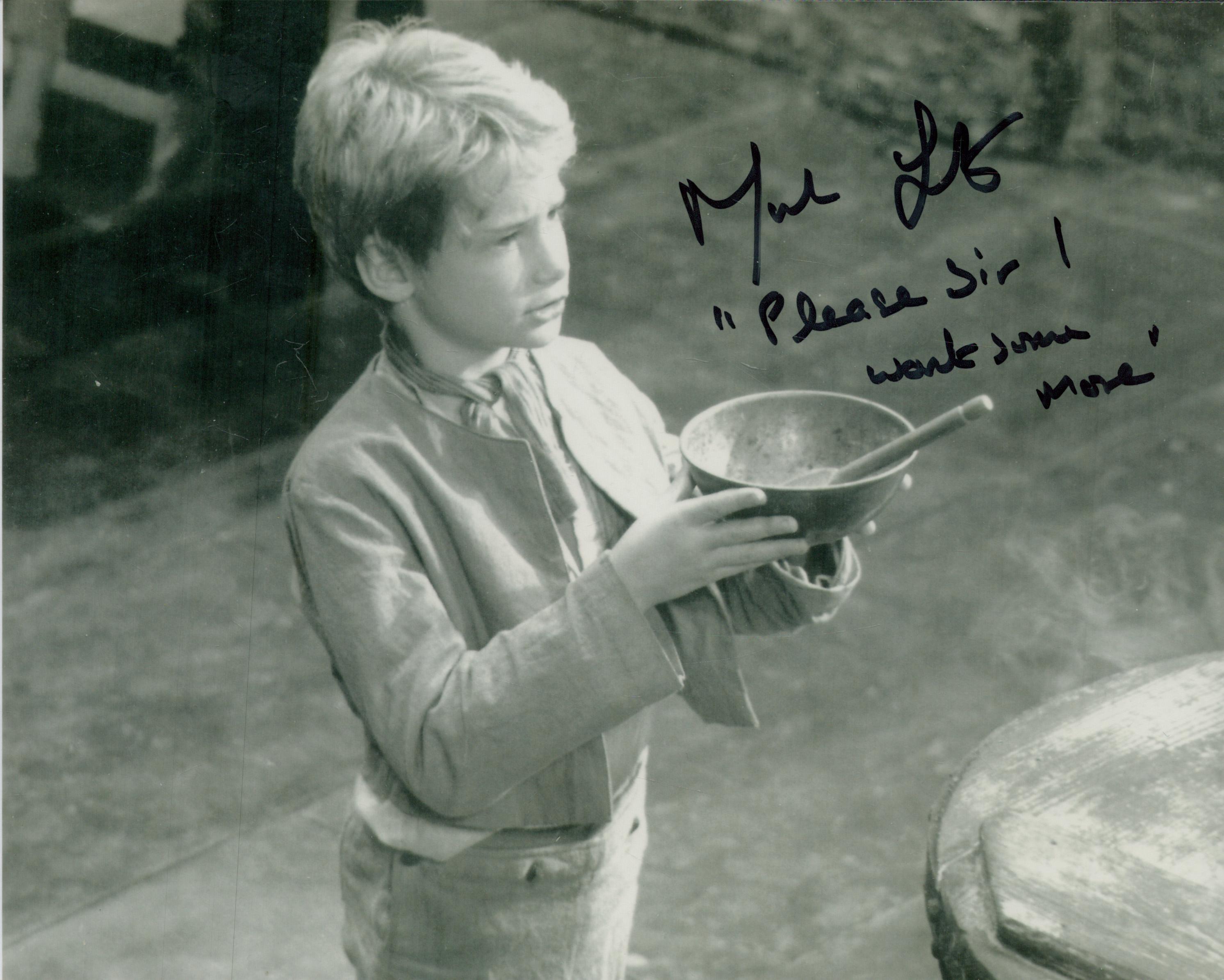 Mark Lester as Oliver signed 10 x 8 inch b/w photo holding out his empty bowl, with immortal