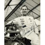 Formula 1 Graham Hill signed rare 10 x 8 inch b/w photo in racing suit, very tough to find in this