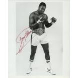 Boxing Larry Holmes signed 10x8 inch black and white photo. Good Condition. All autographs come with