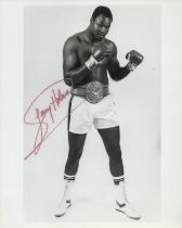 Boxing Larry Holmes signed 10x8 inch black and white photo. Good Condition. All autographs come with